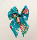 Floral patterned bow on a light gray background
